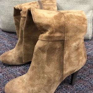 Suede brown booties with a heel.